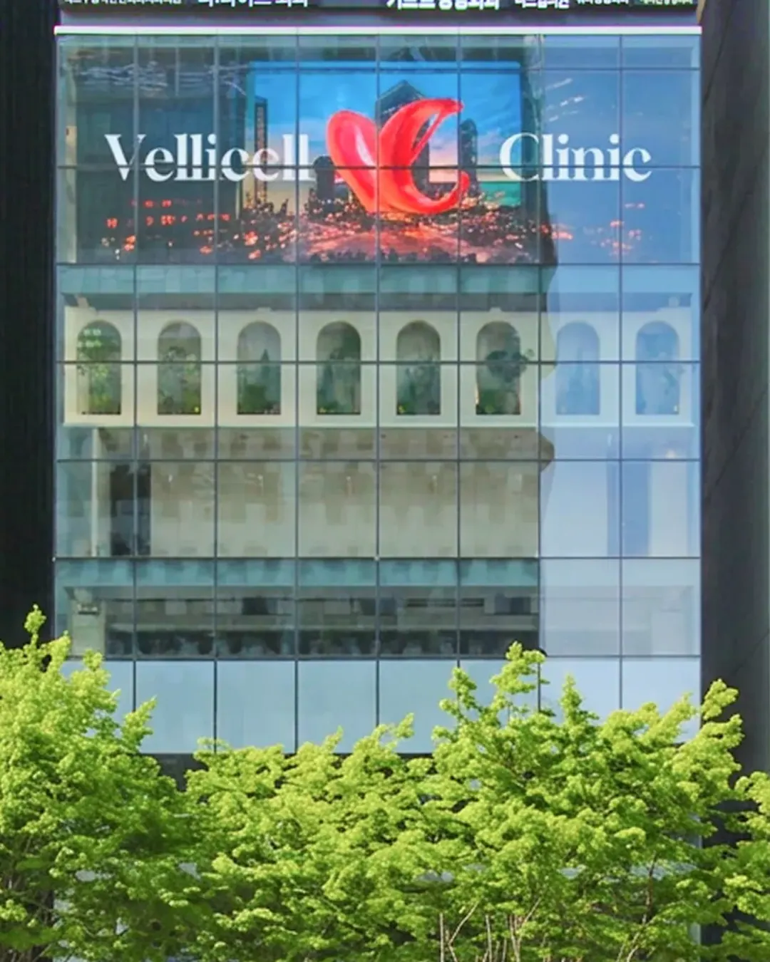 The Vellicell Clinic sign on the OPUS 407 building on Gangnam-daero